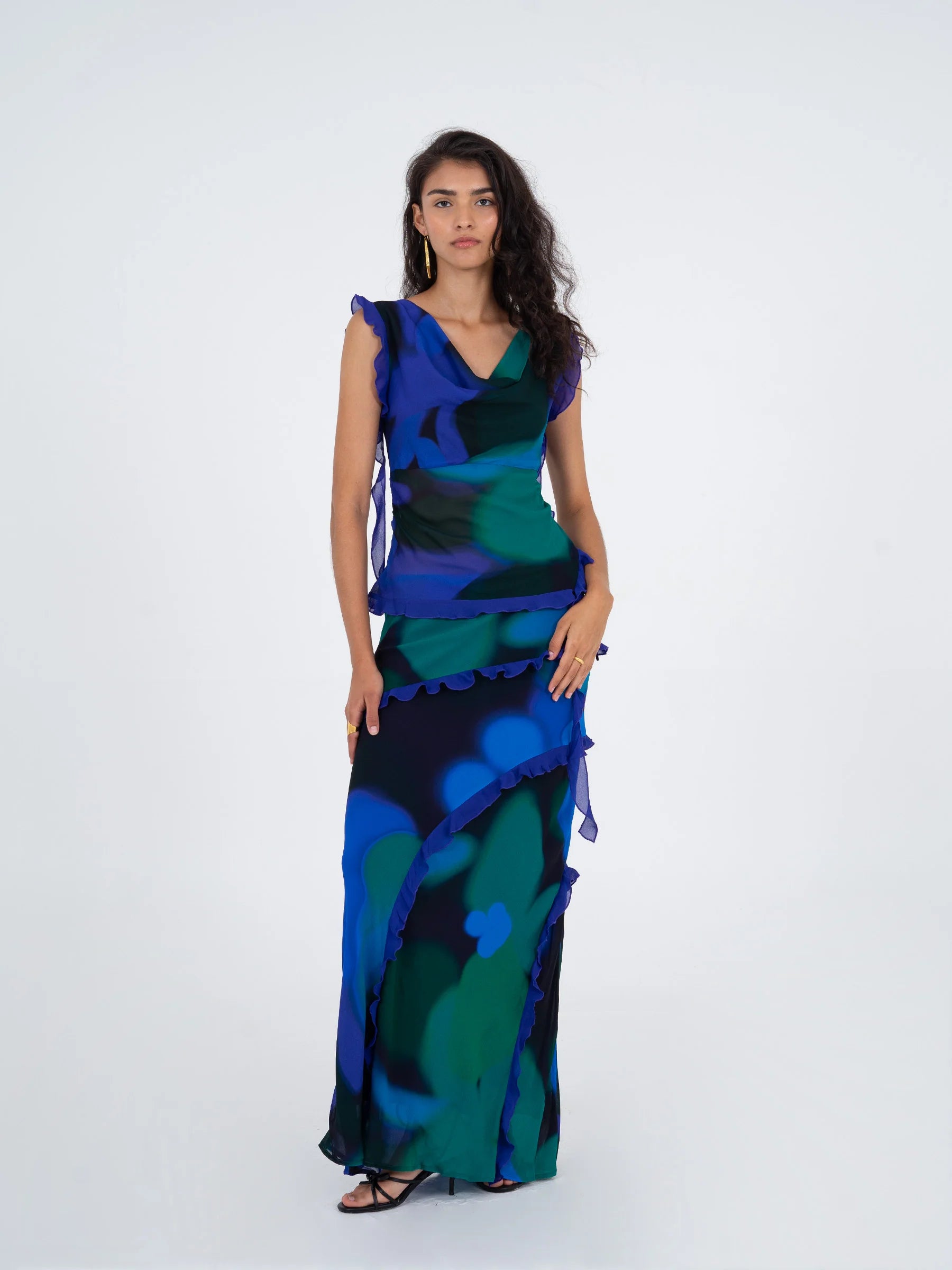 Blue multicolor printed sleeveless blouse styled with matching printed skirt elegant summer outfit