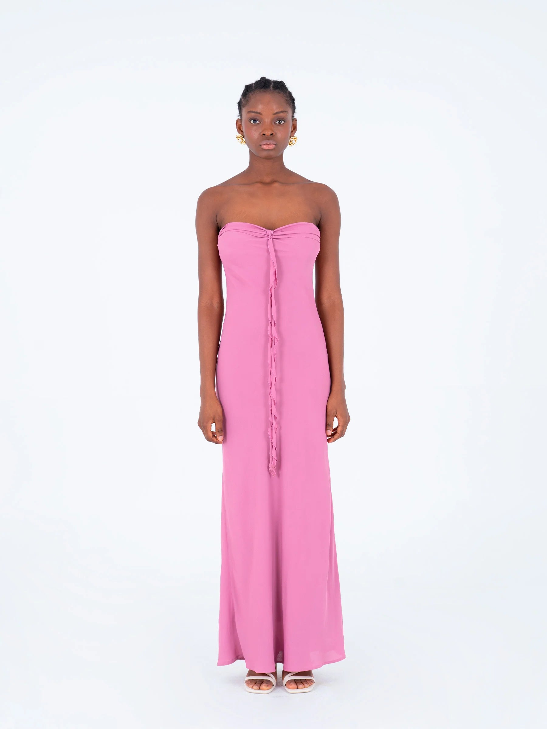 Carmen Says pink strapless maxi dress front studio shot with ruffled chest detail long feminine silhouette