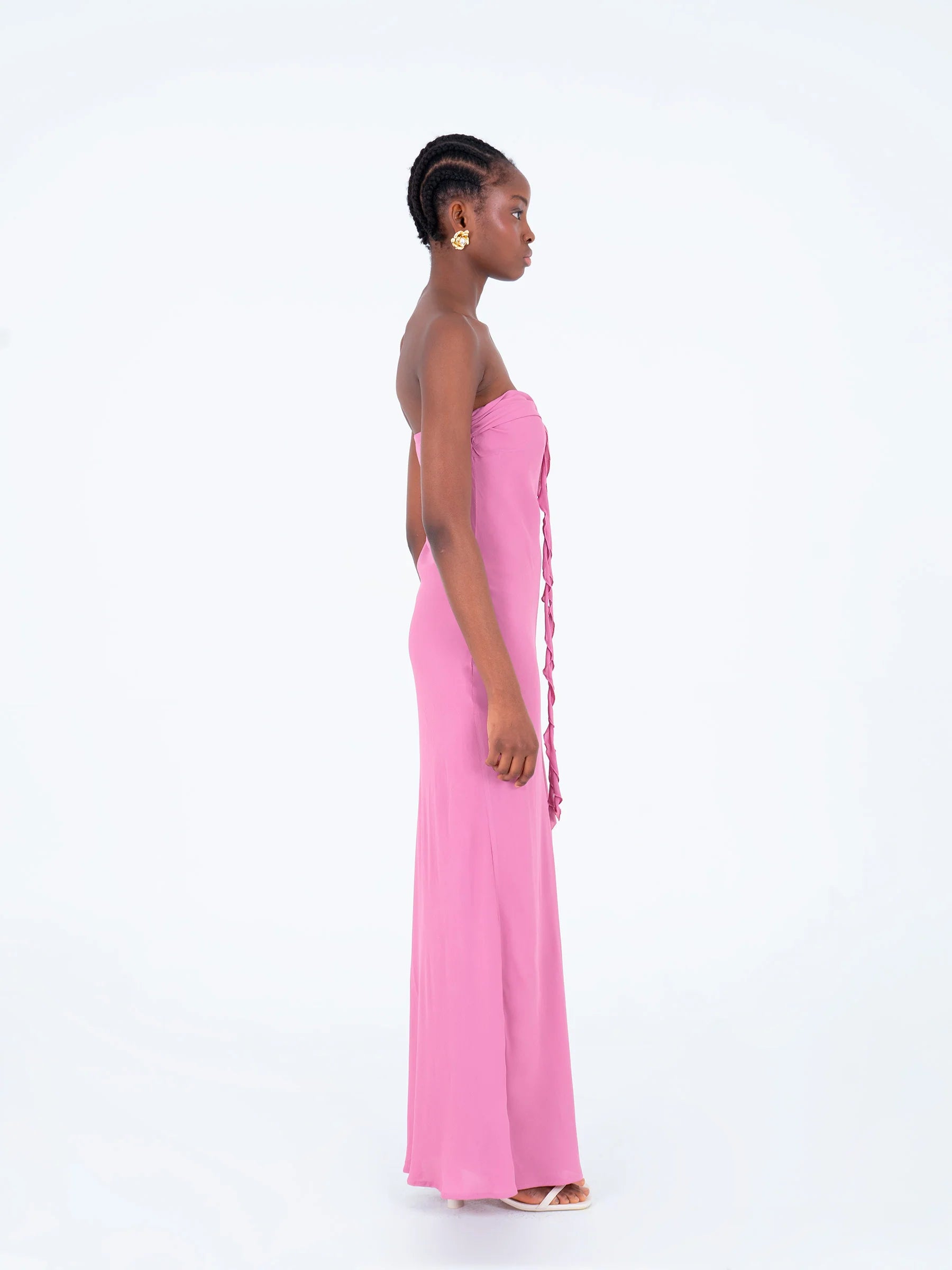 Pink strapless maxi dress side view long fitted silhouette with ruffled chest detail summer evening dress