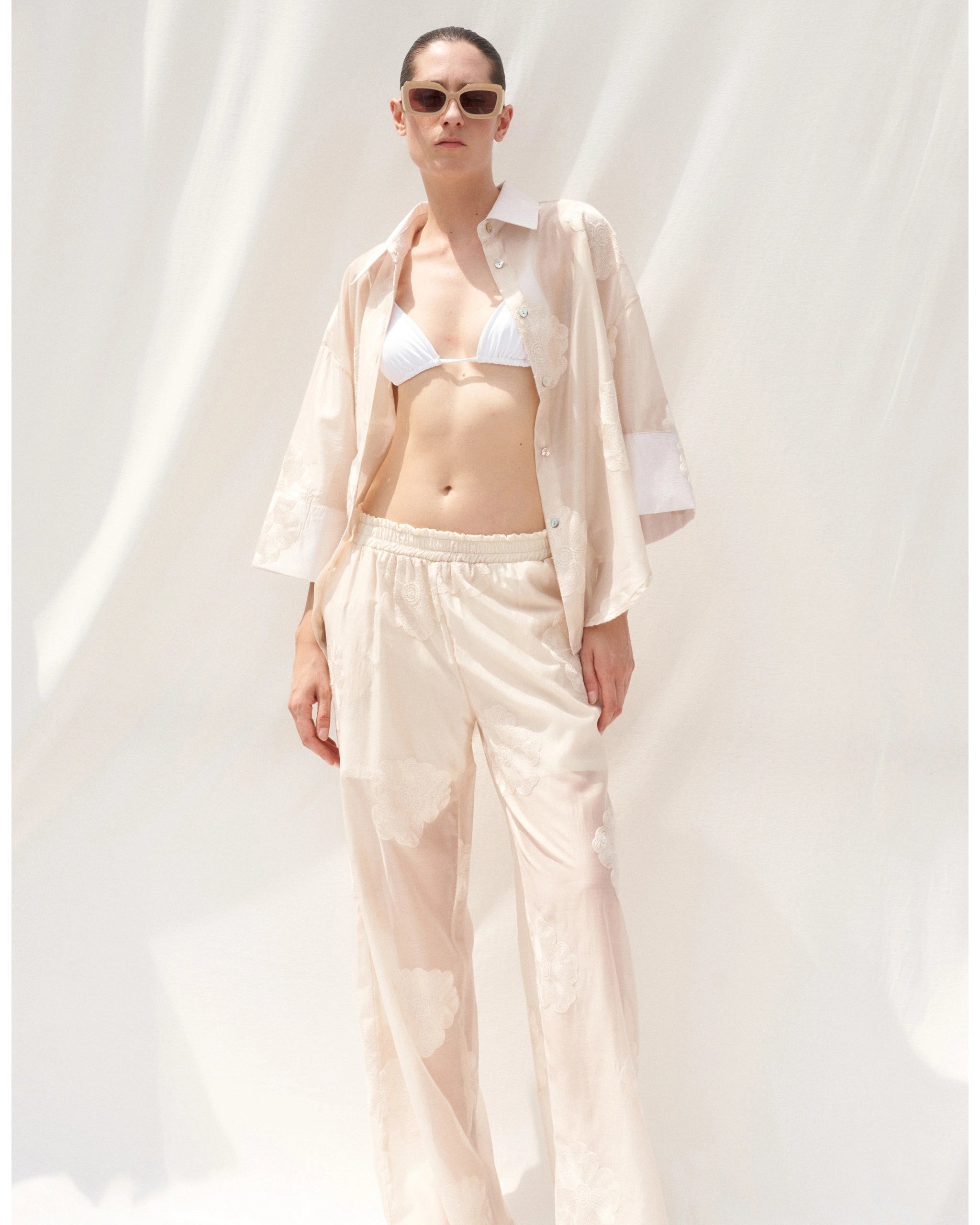 Beige embroidered shirt full length front view