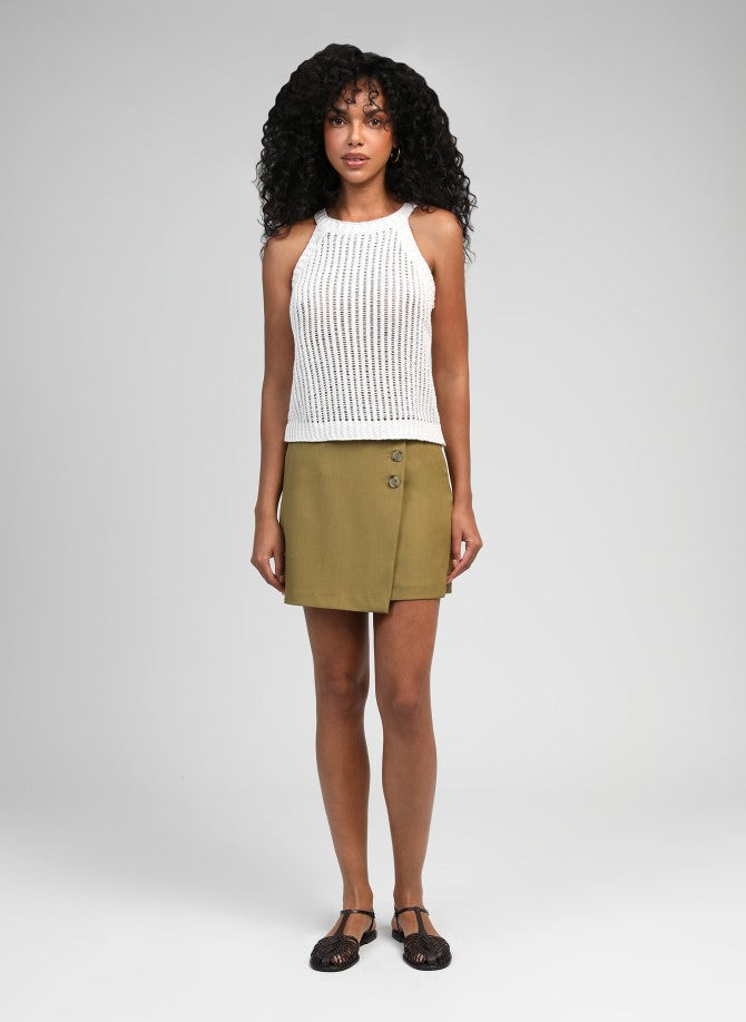 An’ge Libra Top ecru sleeveless knit top full body front look with skirt