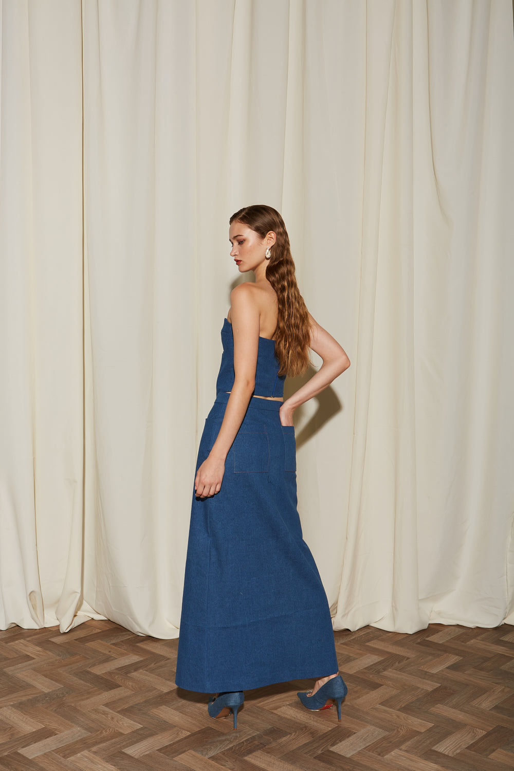 Ananke denim long skirt with front slit full outfit back view