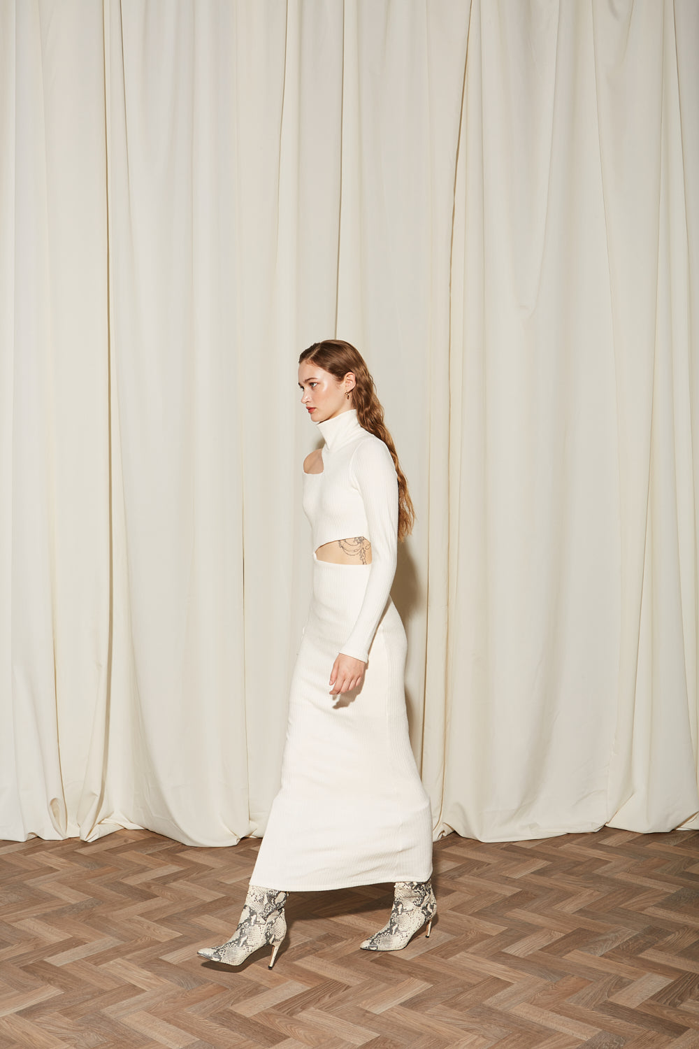 Ananke white midi dress side walking pose