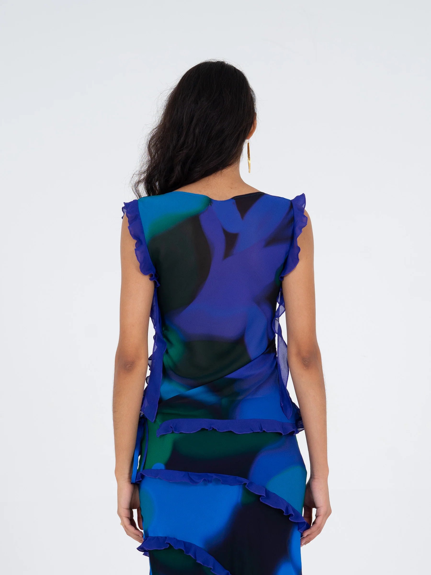 Carmen Says blue multicolor printed sleeveless blouse back view with ruffle detailing and relaxed fit
