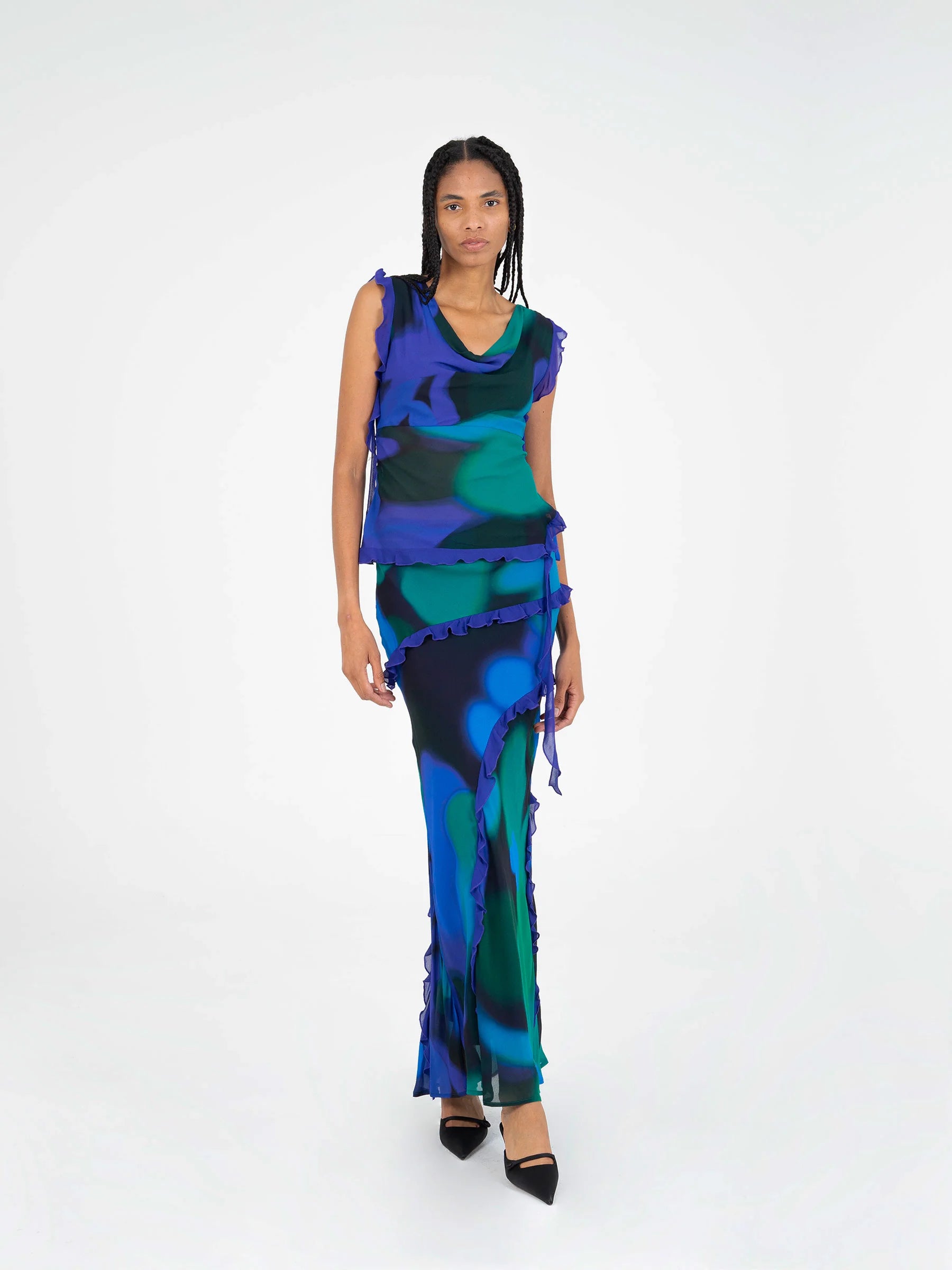 Blue multicolor printed sleeveless blouse studio full body look with ruffle hem and side slit detail