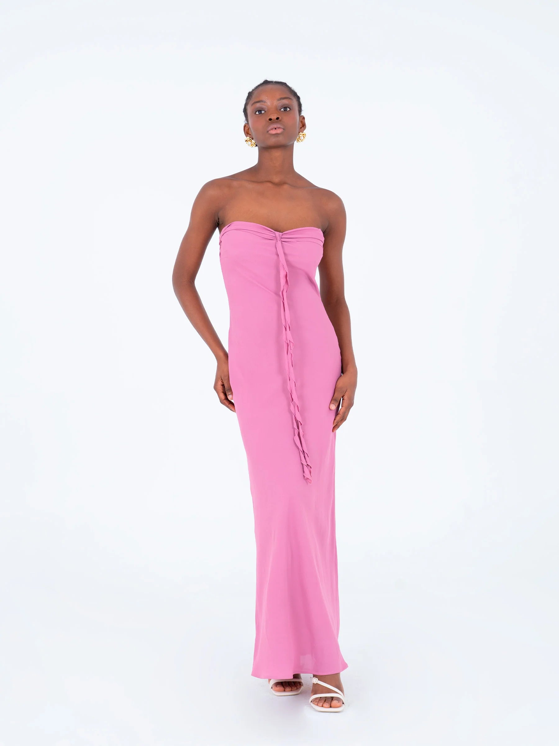 Pink strapless maxi dress model pose highlighting ruffled chest detail long feminine summer dress