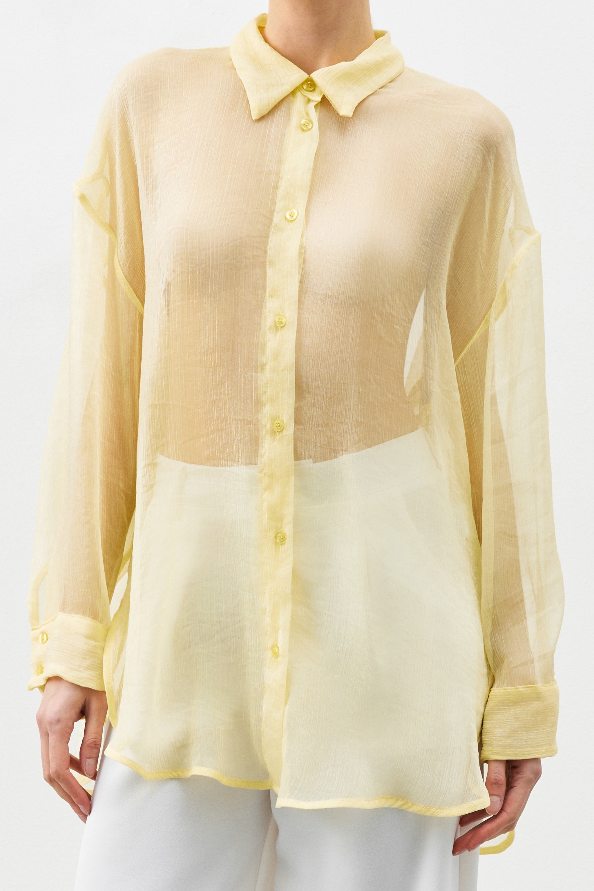 Chloe Shirt yellow semi-transparent shirt close up detail central button closure long sleeves oversized fit
