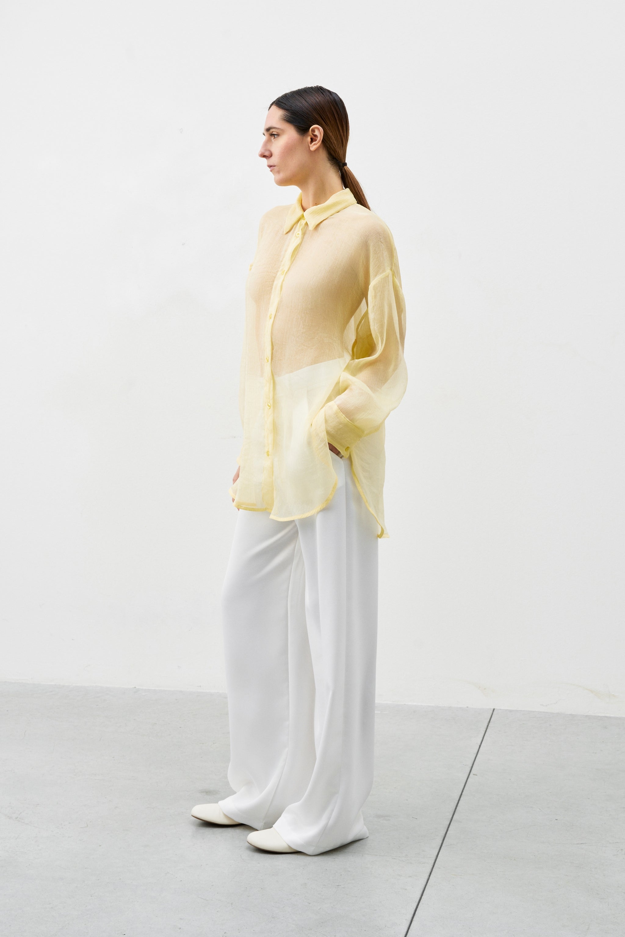Chloe Shirt yellow semi-transparent oversized shirt side view with collar and long sleeves