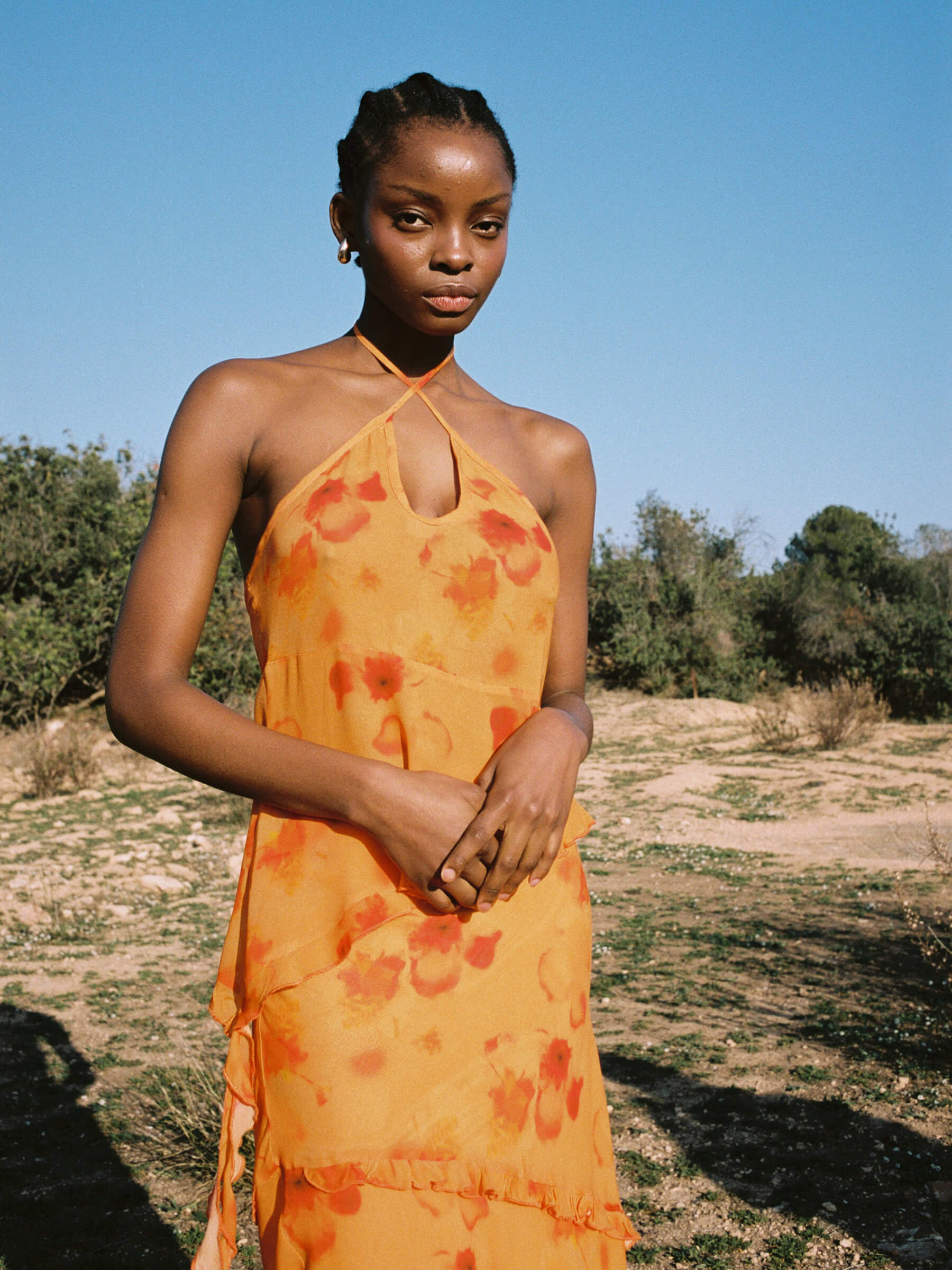Carmen Says orange halter neck blouse outdoor front look with neckline slit and ruffled hem detail viscose summer top