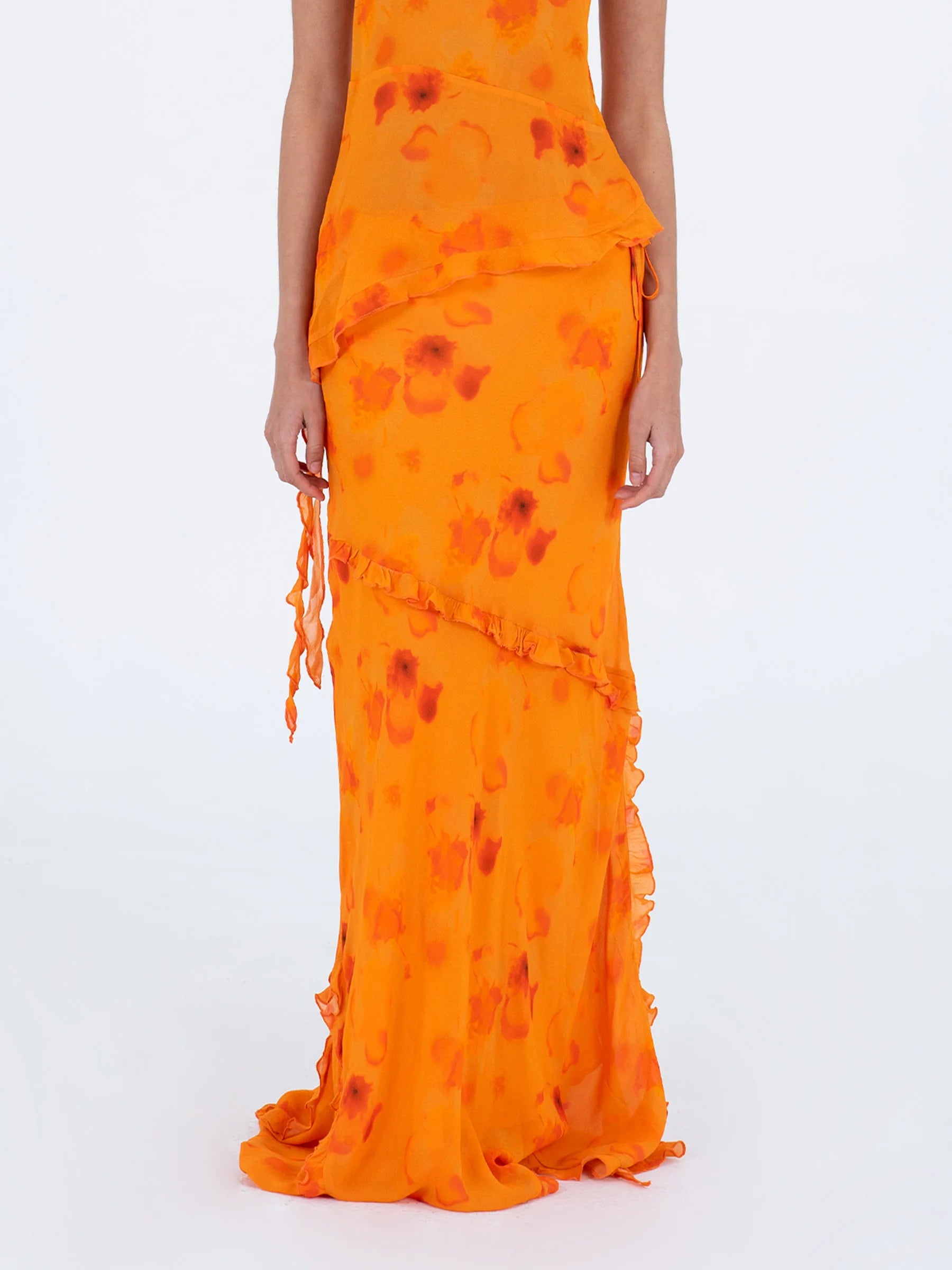 Orange long low rise skirt front detail with decorative ruffles and adjustable side straps 100% viscose