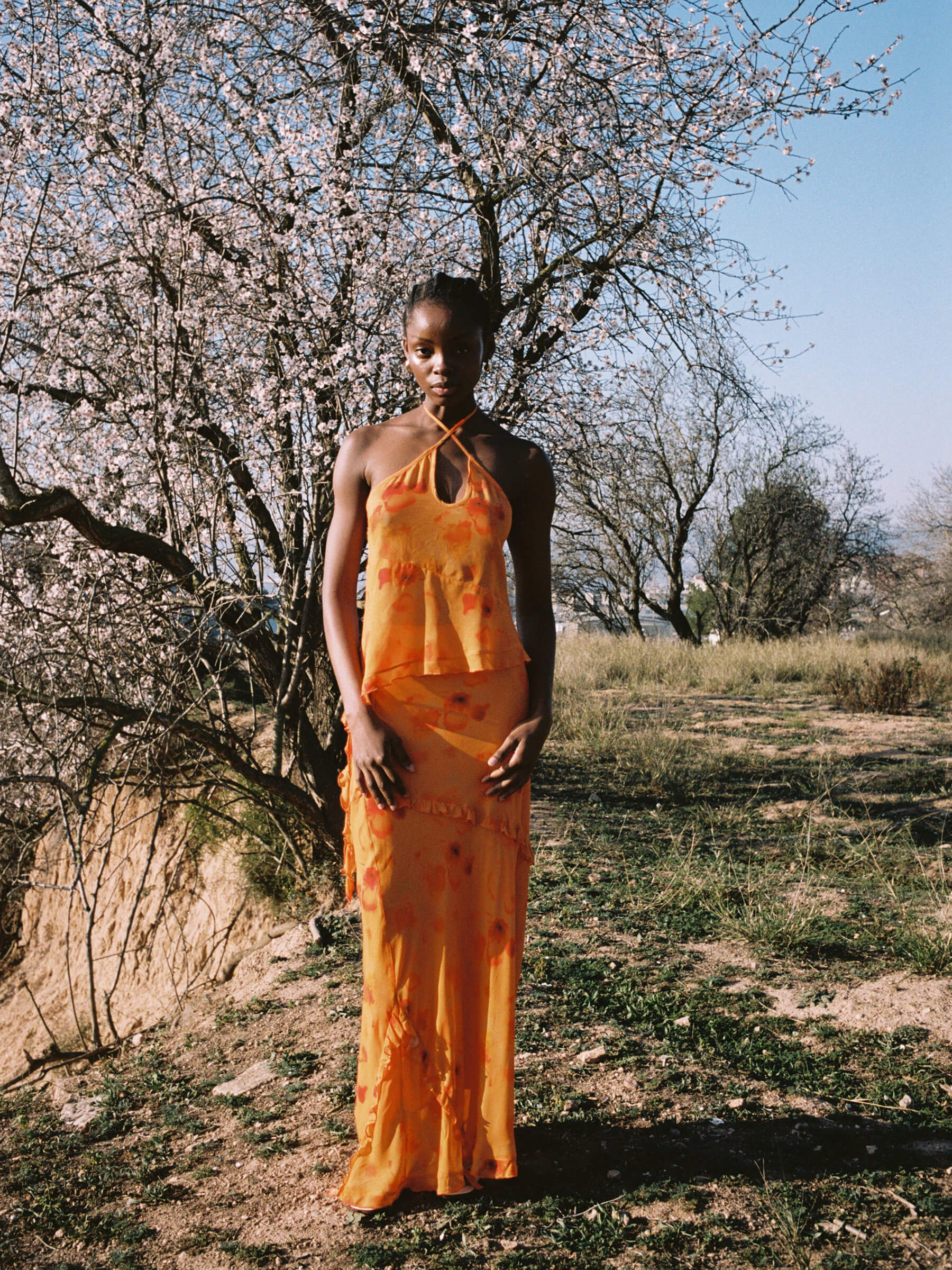 Orange long low rise skirt outdoor look with decorative ruffles and adjustable side straps lightweight viscose summer skirt