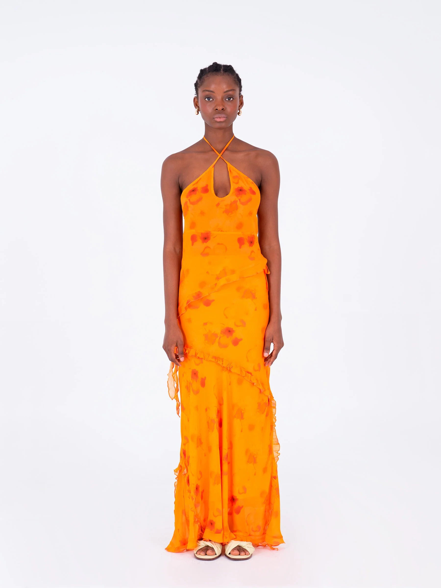 Orange long low rise skirt straight front view with decorative ruffles and soft summer movement