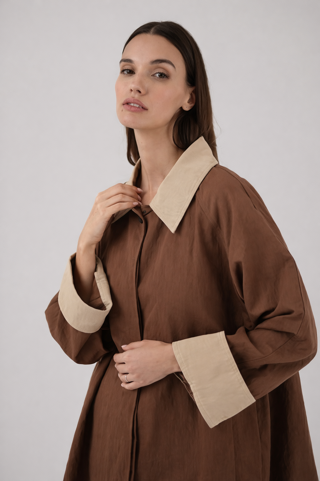 Brown oversized trench coat collar detail