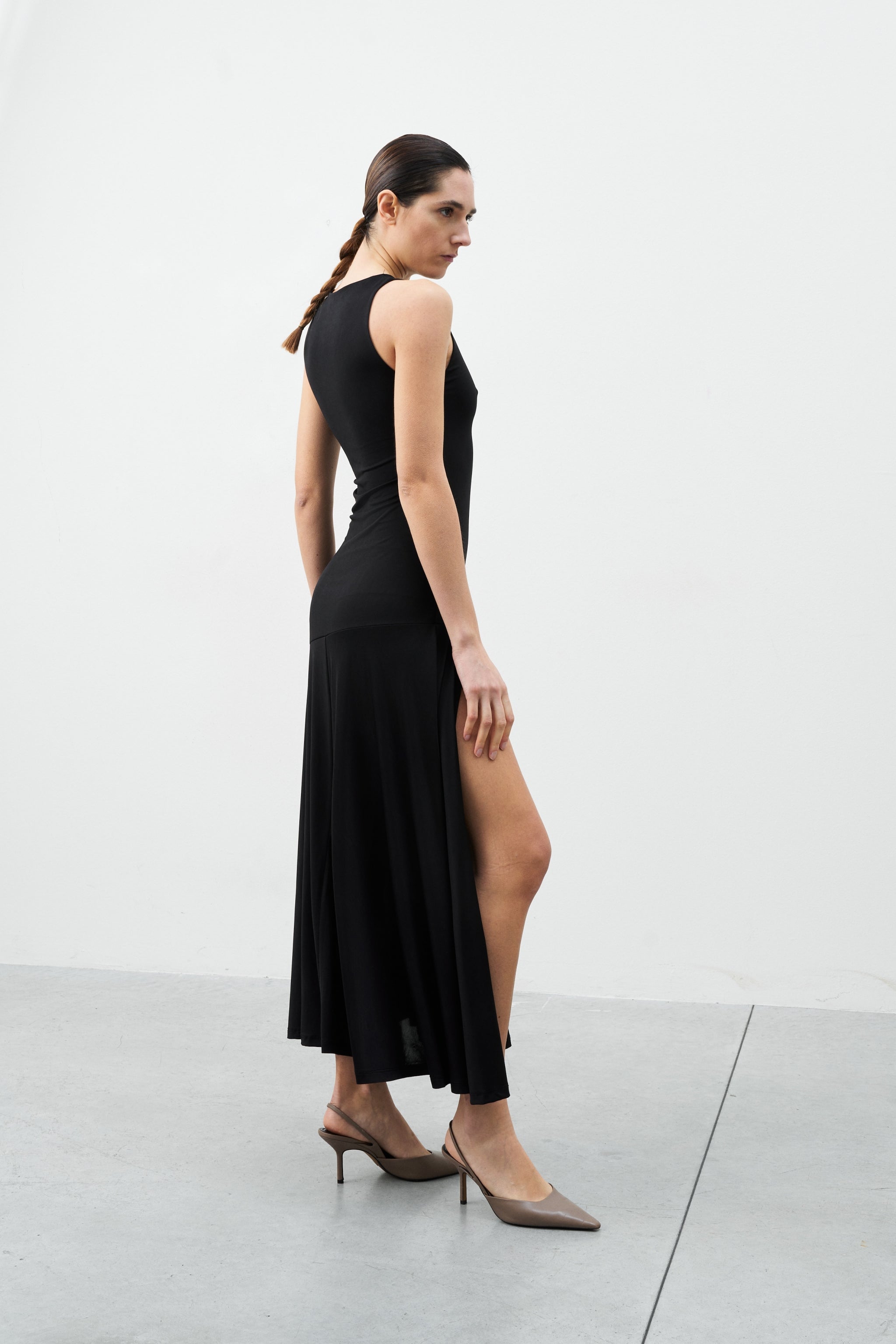 Mirage Dress black sleeveless midi dress side view relaxed fit hem stitching detail