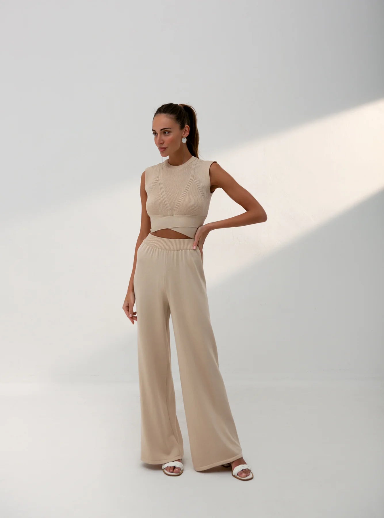 Cream wide leg trousers full length view