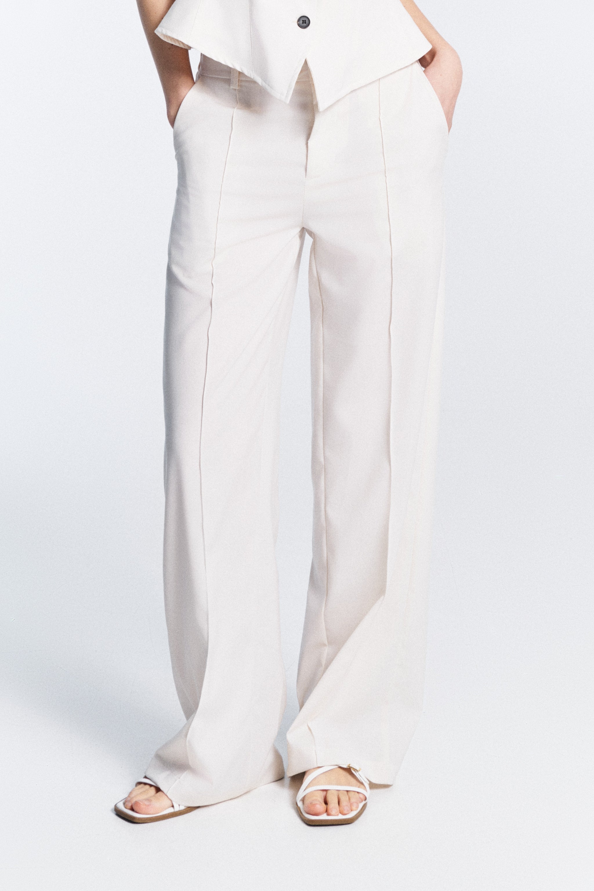 Serena Trousers white high waisted trousers with belt loops and side pockets front detail zip and hook closure regular fit made in Italy