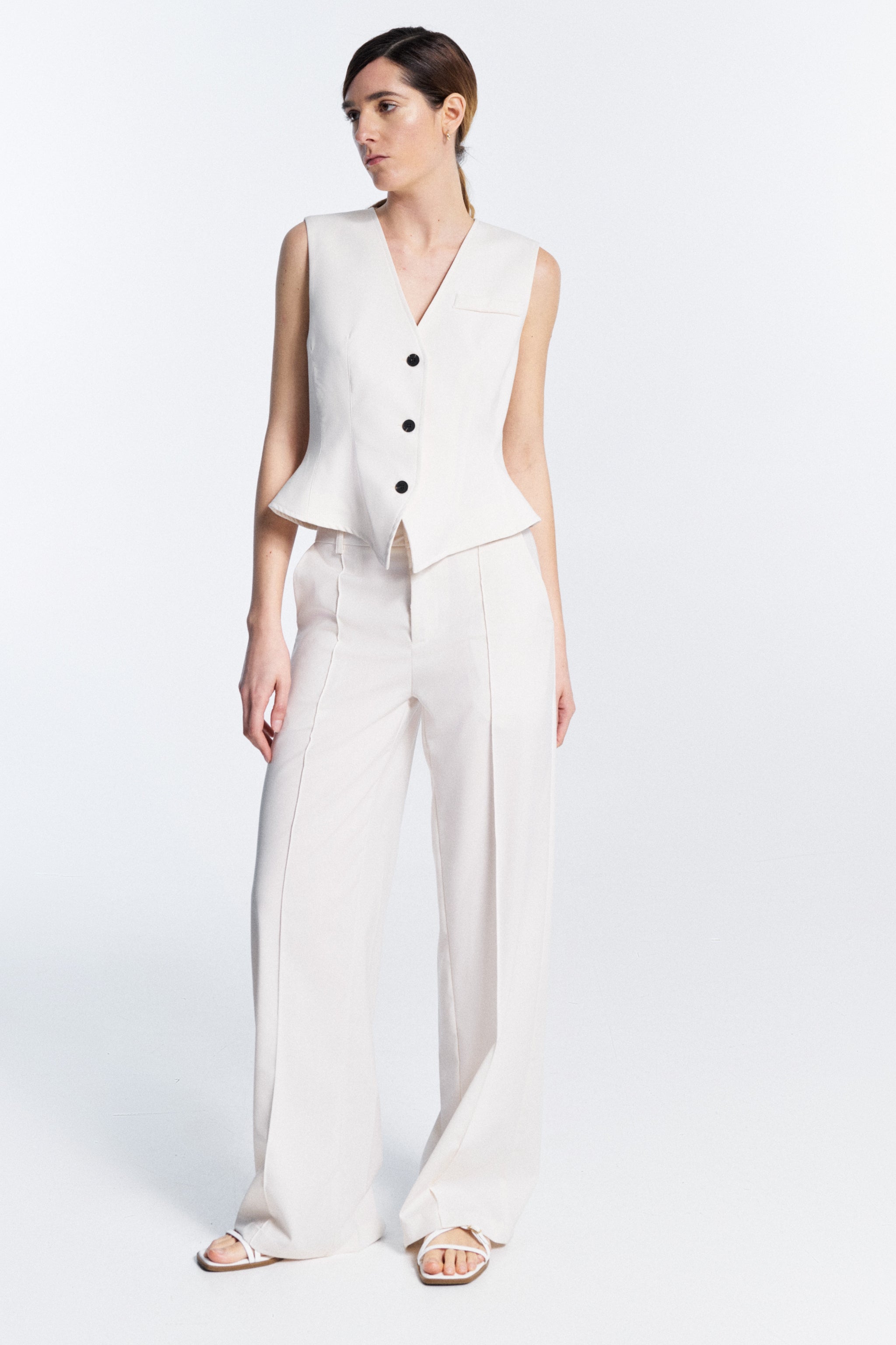 Serena Vest white V neck vest front view with button fastening front welt pocket regular fit