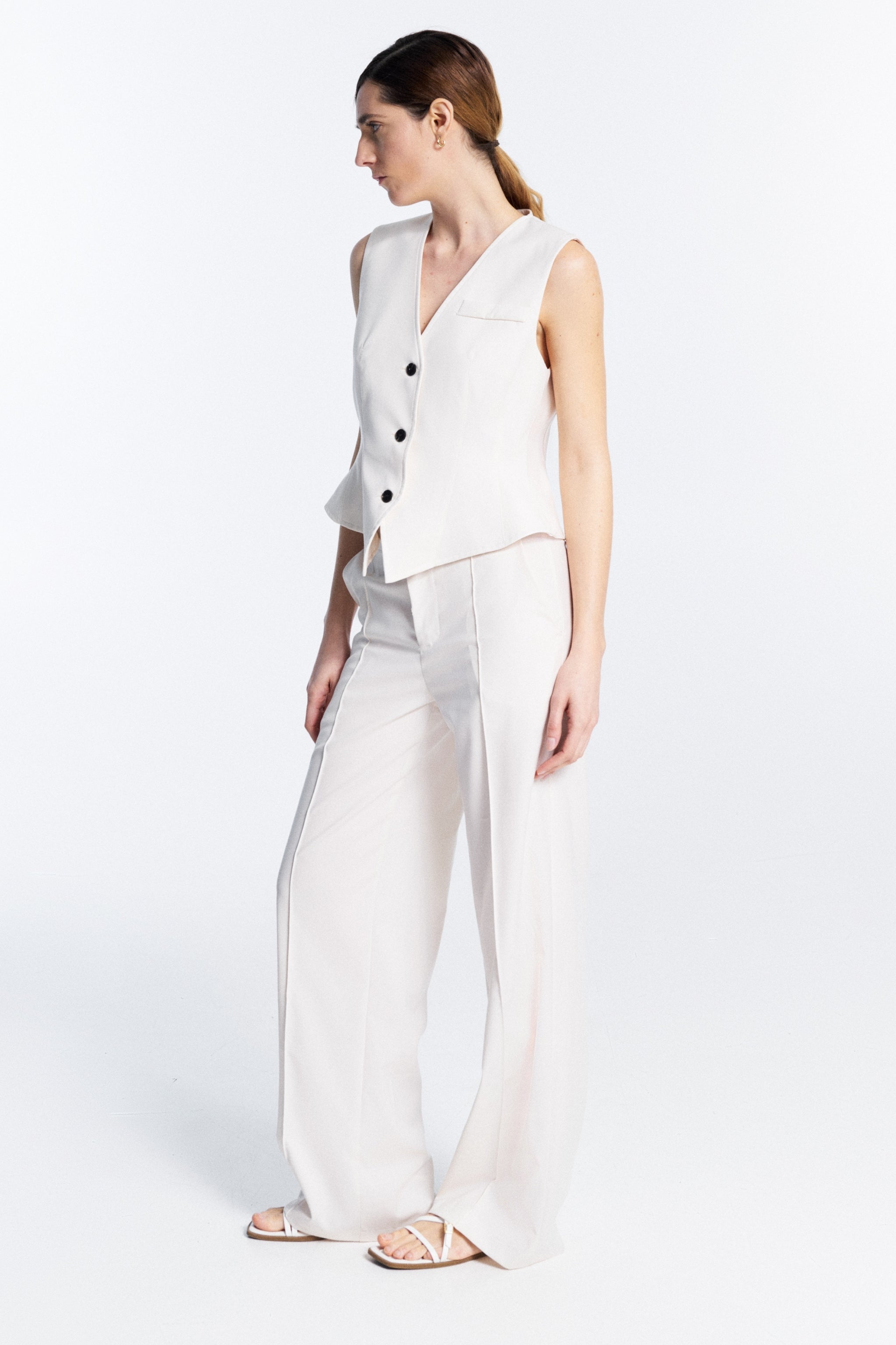 Lumina white V neck vest full look styled with matching high waisted trousers